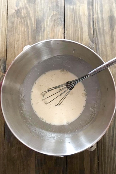 mixing starter, water, salt and oil in mixing bowl