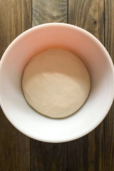 the dough has doubled in a white bowl