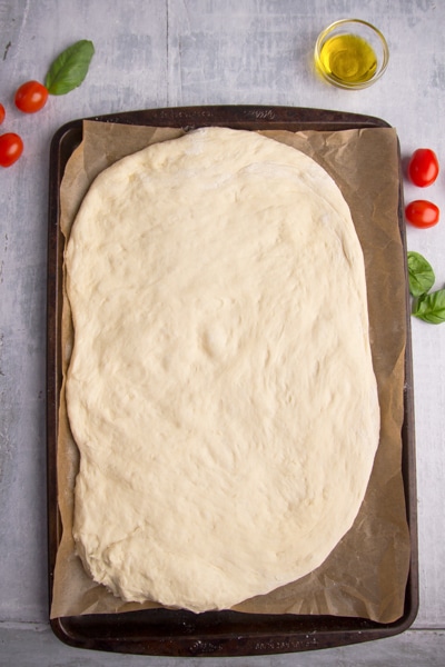 shaping the dough on a wooden board