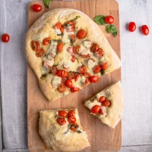 baked pizza on a wooden board.