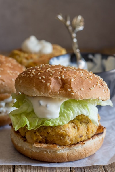 Salmon patty in a burger bun.