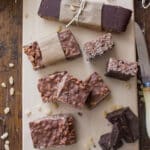 Chocolate bars on a white wooden board.