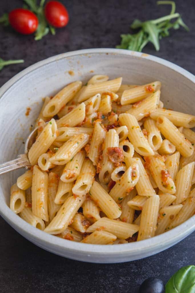Pasta with pesto in a bowl.