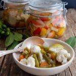 Giardiniera in a white dish and some in a jar.