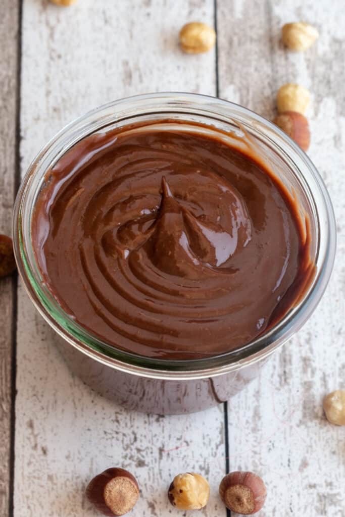 Homemade Nutella in a glass jar.