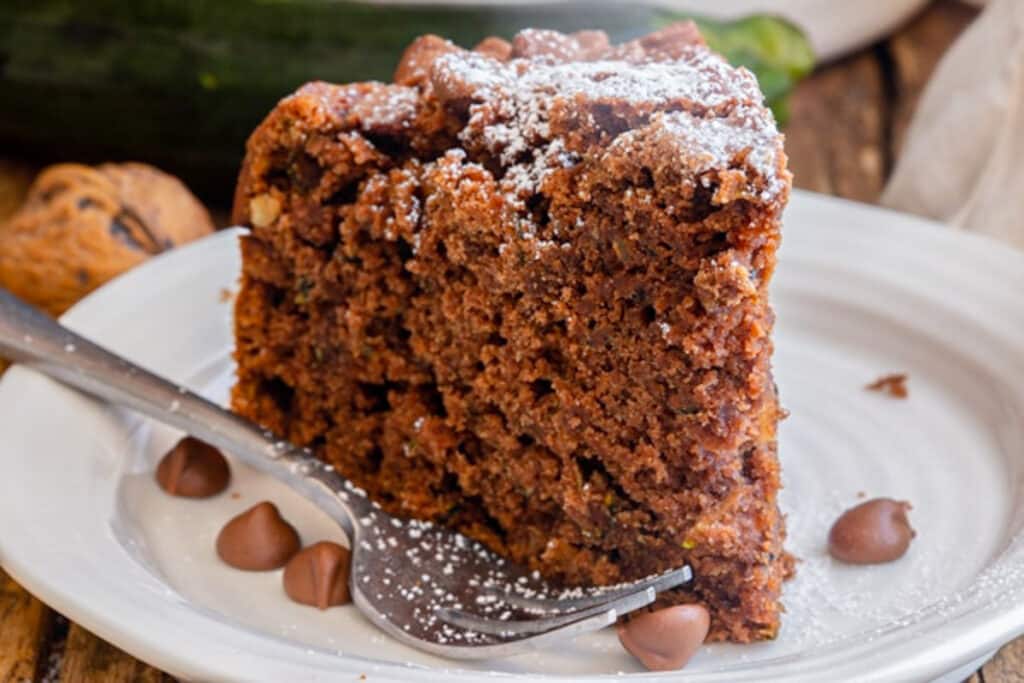 A slice of cake on a white plate.