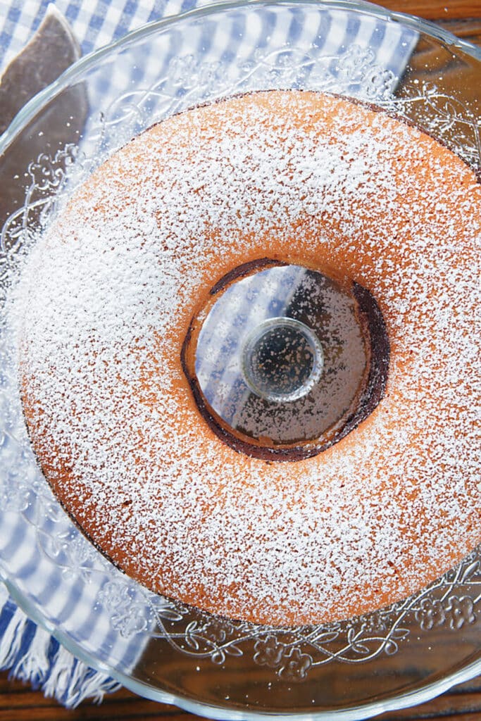 The baked cake on a cake plate.