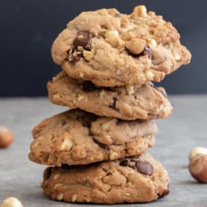 Four chocolate drop cookies stacked.