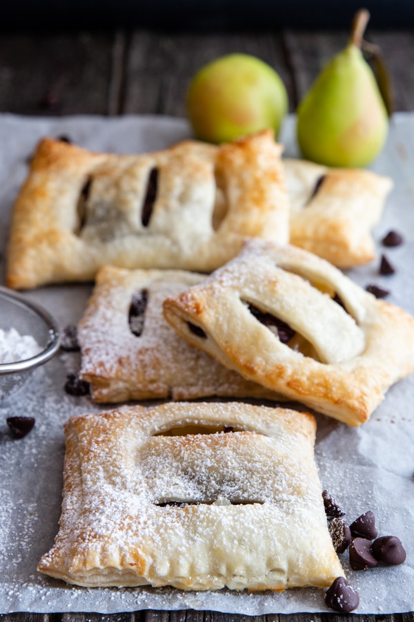 5 pear pastries on a white paper