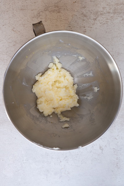 butter & sugar creamed in silver mixing bowl