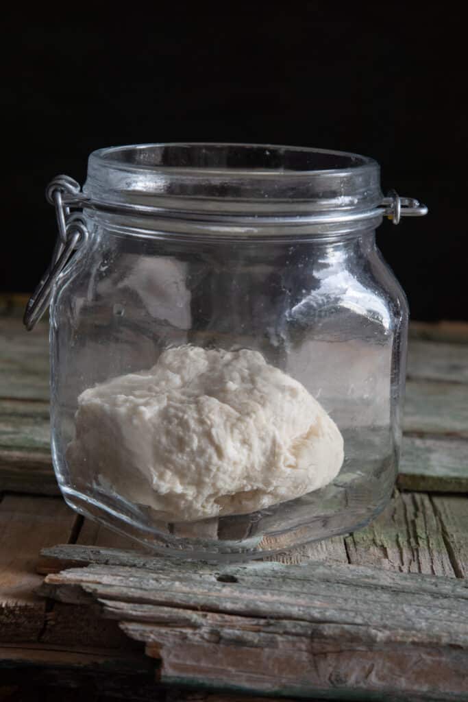 The fed starter in a glass jar.