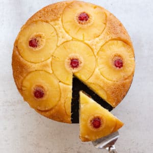 pineapple upside-down cake with a slice cut