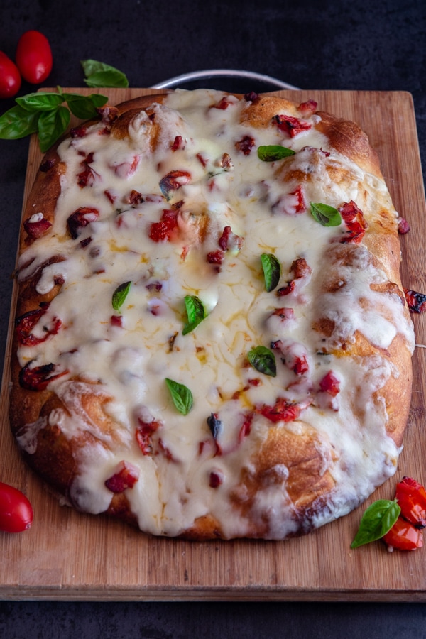 pizza on a wooden board made with lievito madre