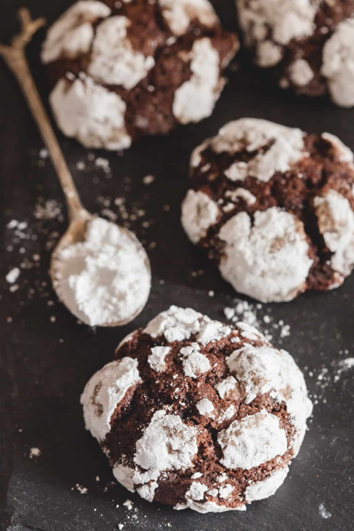 Crinkle cookies on a black board.