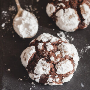 Crinkle cookies on a black board.