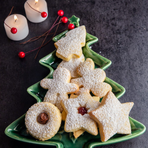 christmas cookies on a green christmas tree plate