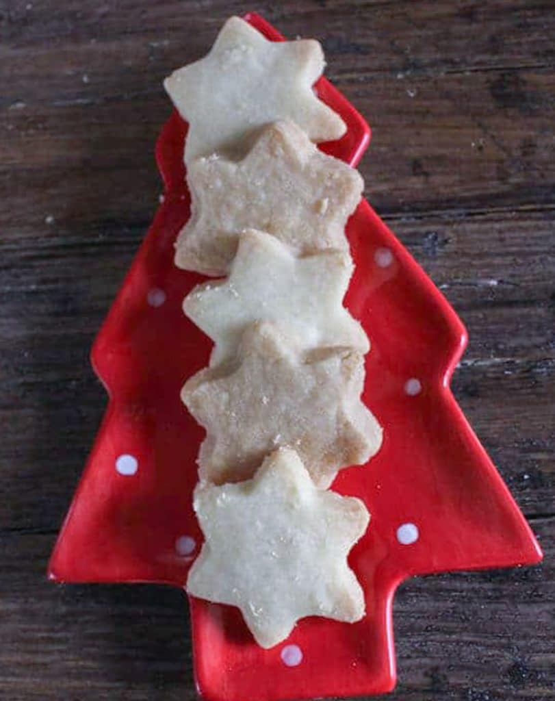 Cookies on a red Christmas tree plate.