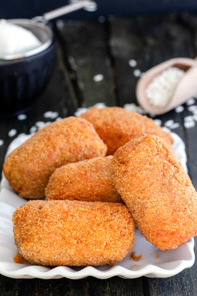 Suppli on a white dish.