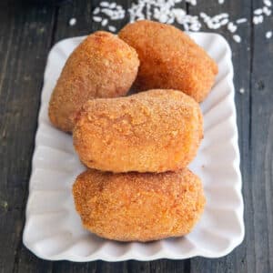 Suppli on a white dish.