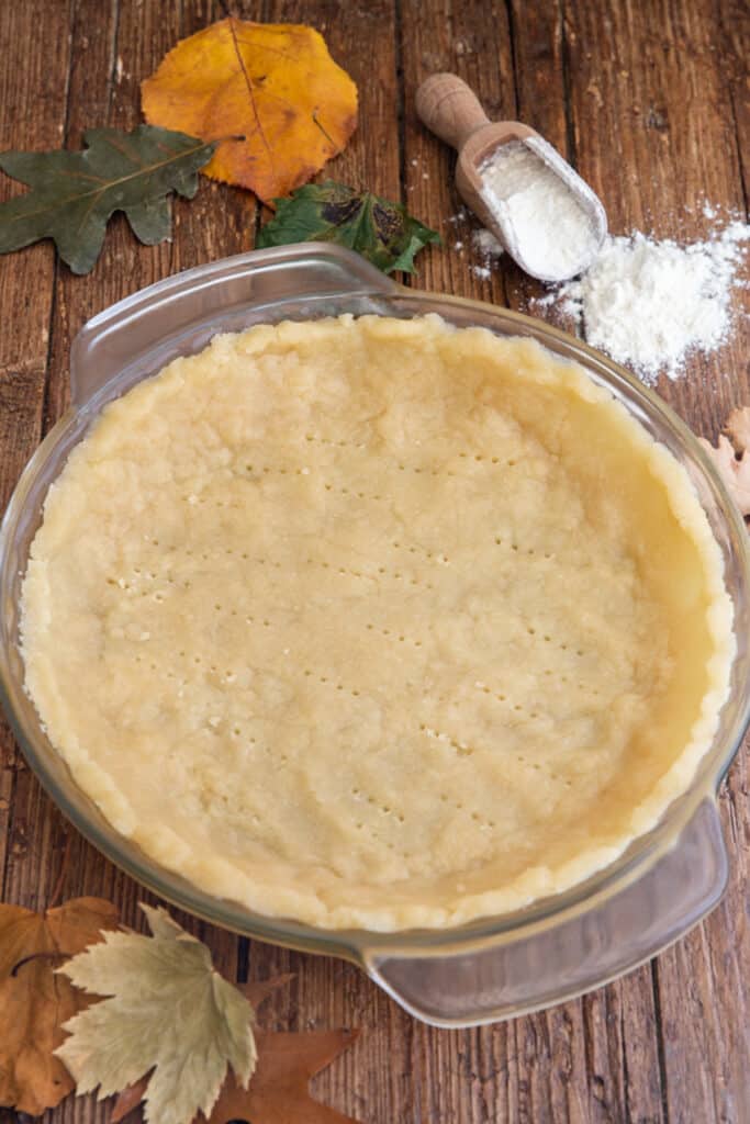 Pie crust in a glass dish.