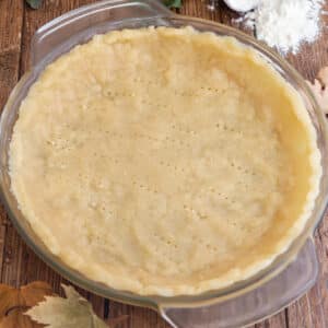 Pie crust in a glass dish.