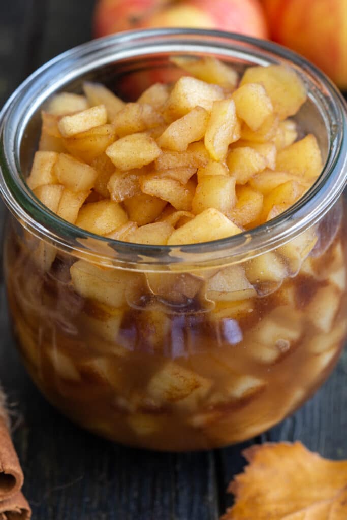 Easy caramelized apples in a glass jar.