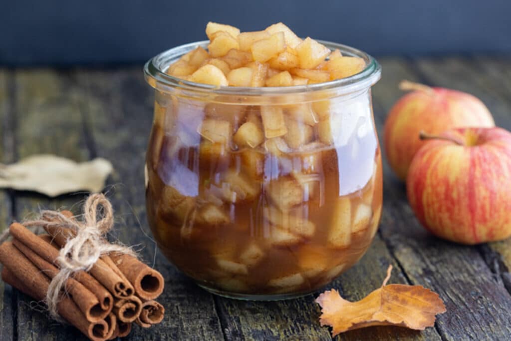 Easy caramelized apples in a glass jar.