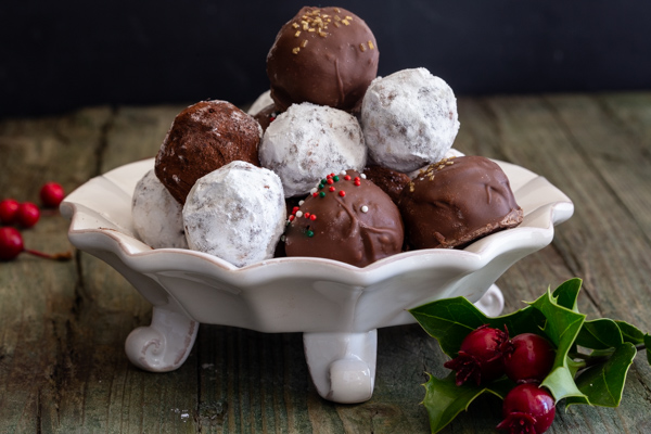 chocolate rum balls on a white plate