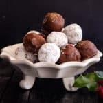 Rum balls on a white plate.