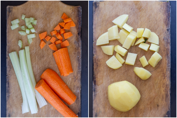 chopped celery & carrots on a board & chopped potatoes on a board