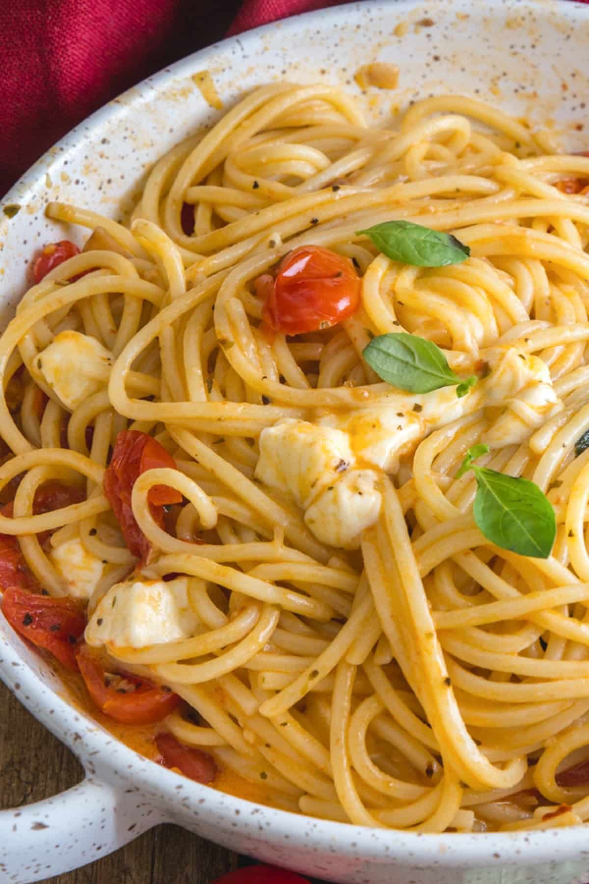 Caprese pasta in a white pan.