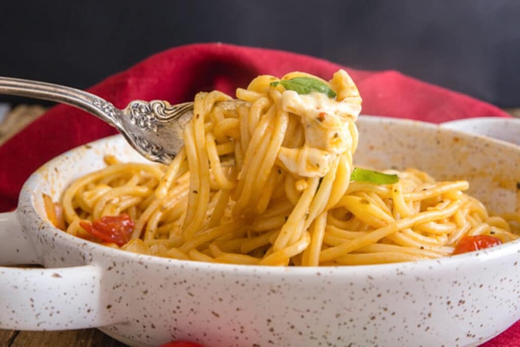 Pasta on silver serving fork.