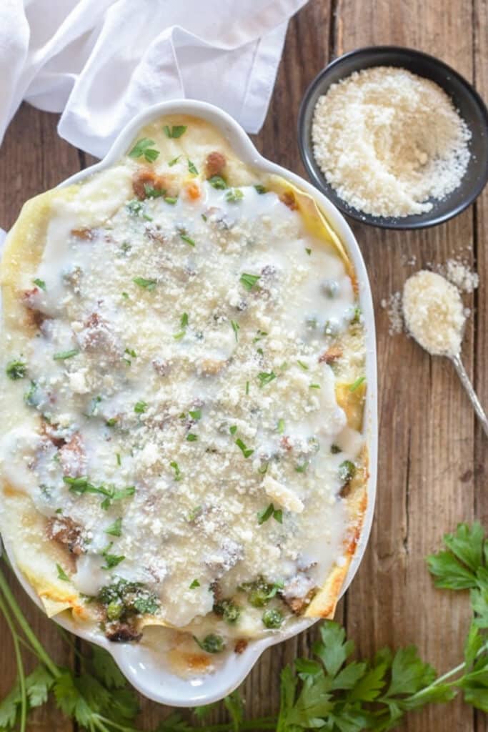 White lasagna in a white pan.