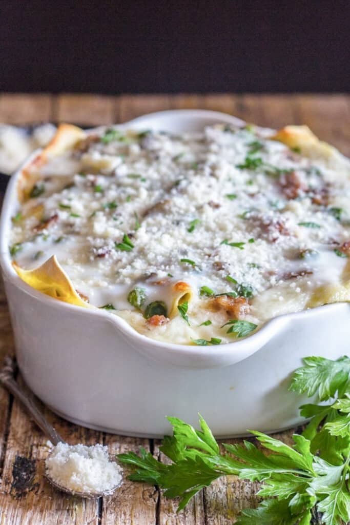 Lasagna baked in a white pan.