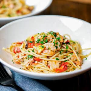 Pasta with seafood on two plates.