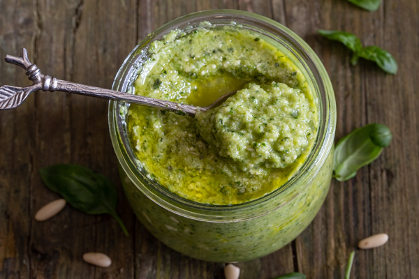 a jar with a spoonful of pesto
