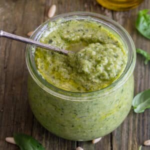 Zucchini pesto in a glass jar.