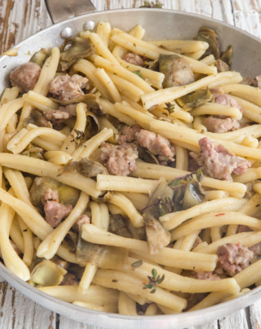 sausage pasta in a silver pan.
