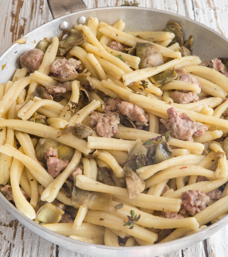 sausage pasta in a silver pan.
