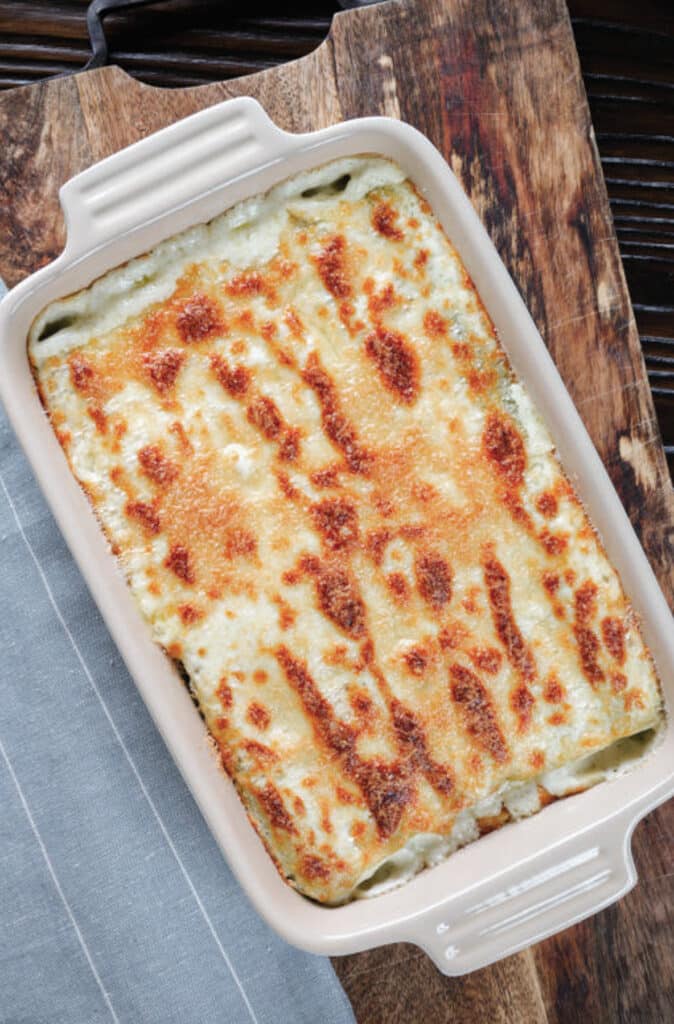 Cannelloni in a white baking dish.