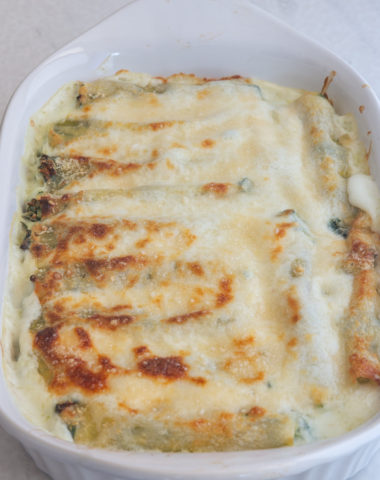 cannelloni in a white baking pan.