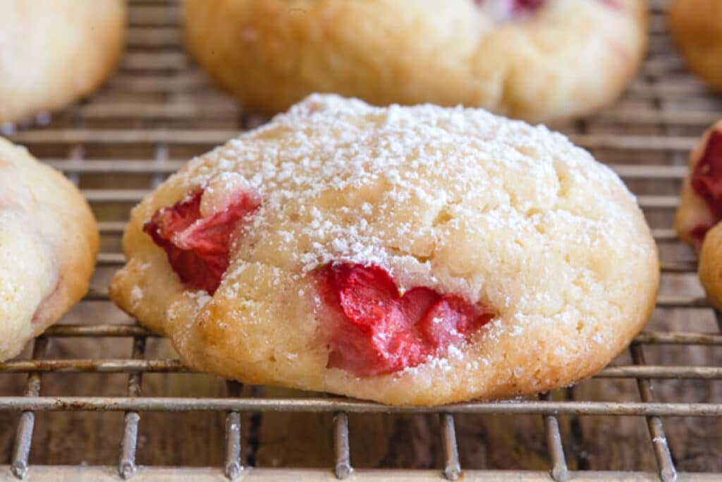 Up close strawberry cookie on a wire rack.