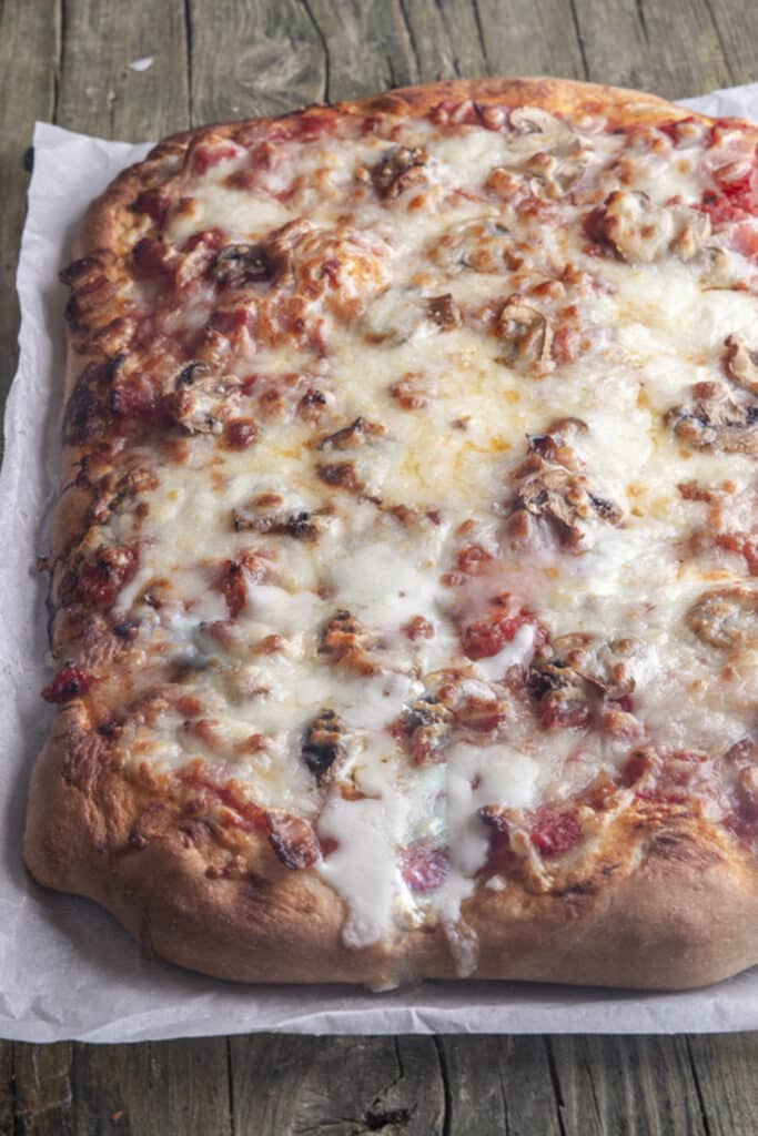 Pizza on parchment paper.