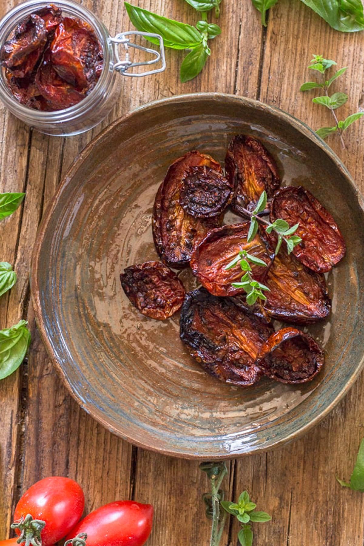 Oven dried tomatoes in a brown plate.