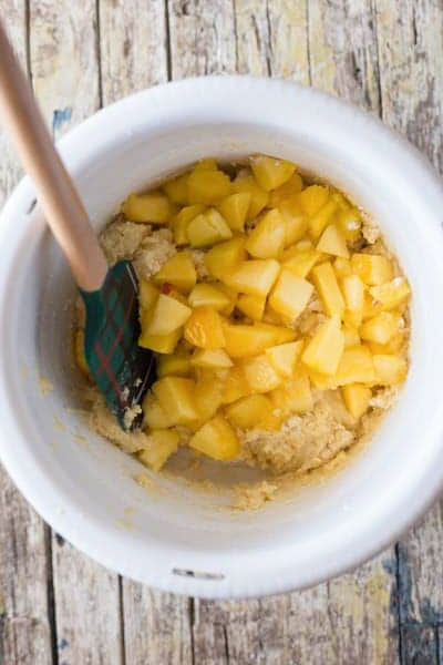 Combine the whisked with the wet ingredients then fold in the chopped peaches.