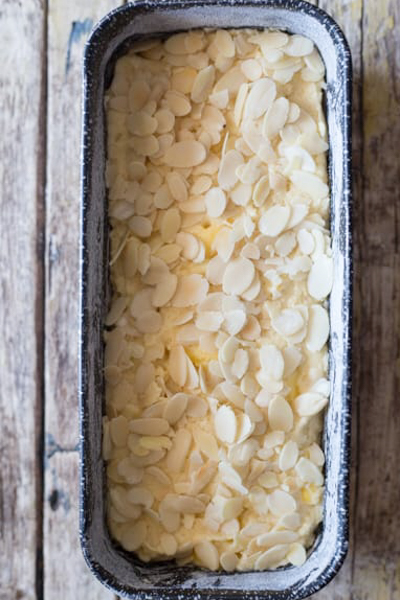 Batter in the loaf pan and almonds sprinkled on top.