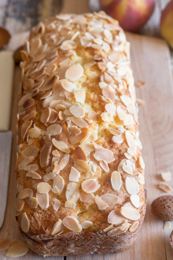 Baked peach bread on a wooden board.