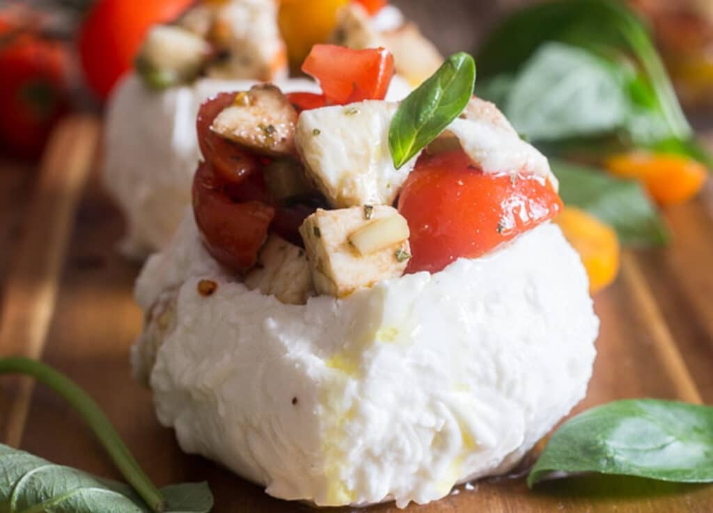 Stuffed caprese on wooden board.