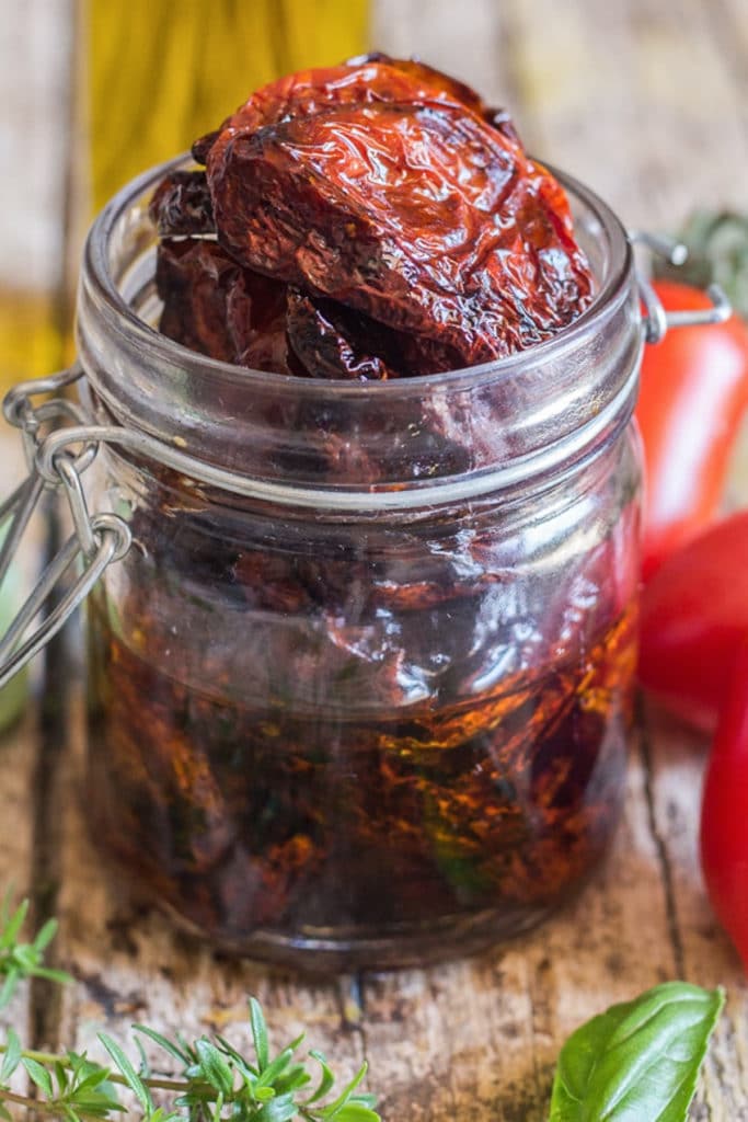 Sun dried tomatoes in a glass jar.