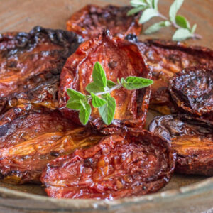 Sun- dried tomatoes in a brown plate.